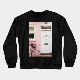 Bicycle against a pink wall Crewneck Sweatshirt